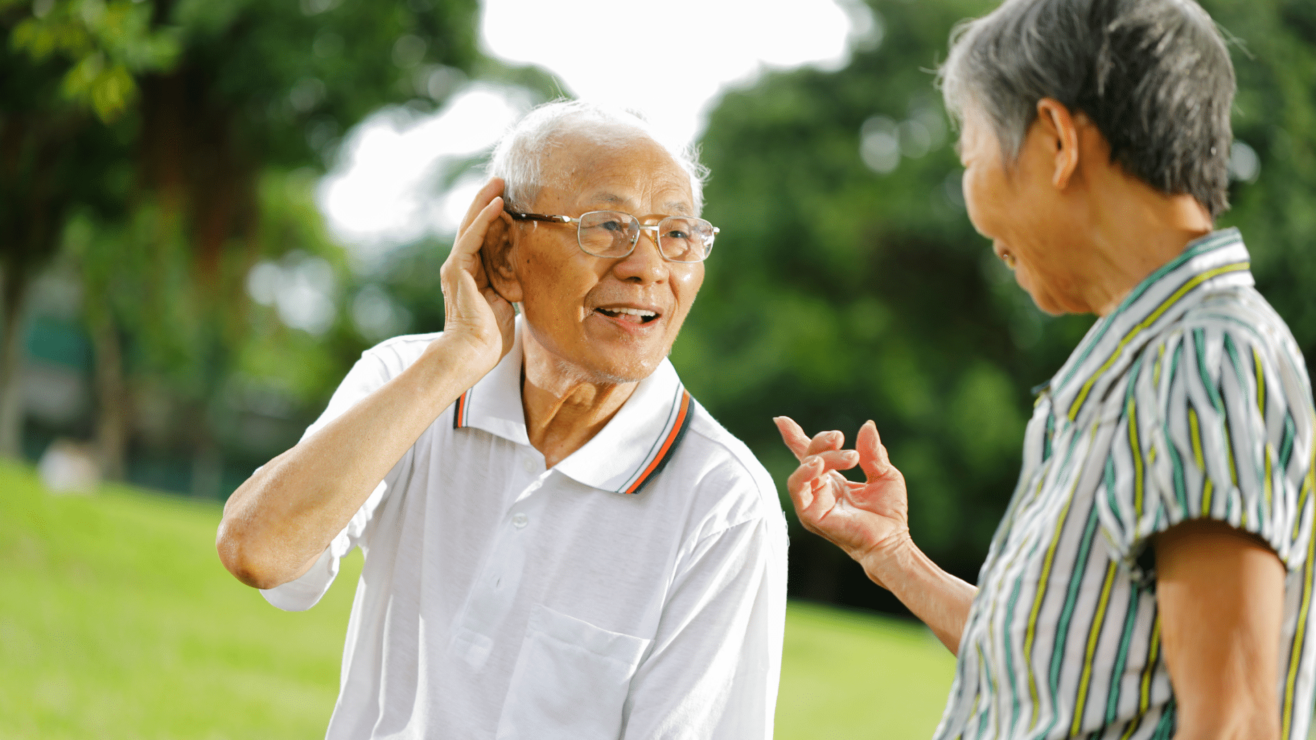 man speaking to someone with hearing loss