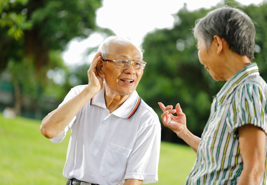 old man having a hard time hearing