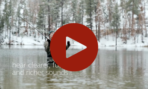 person in a river, fishing, with a play icon on top
