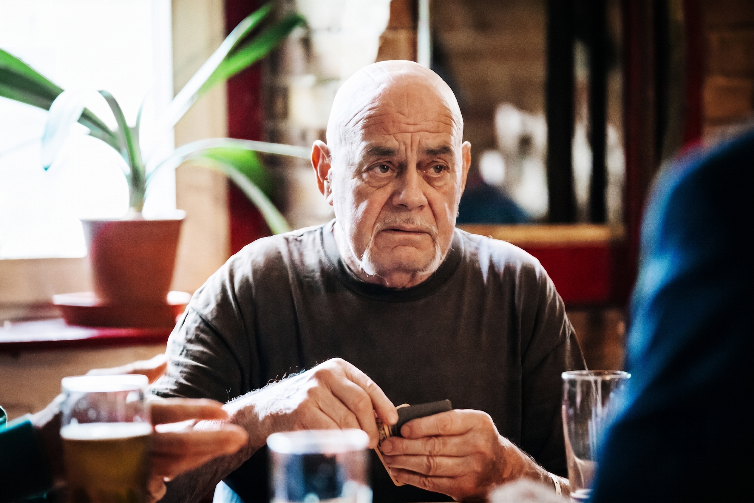 Adult straining to follow a conversation in a noisy room copy Adult straining to follow a conversation in a noisy room — a common sign of auditory processing disorder
